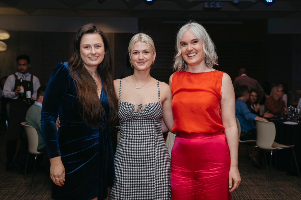 three people smiling 