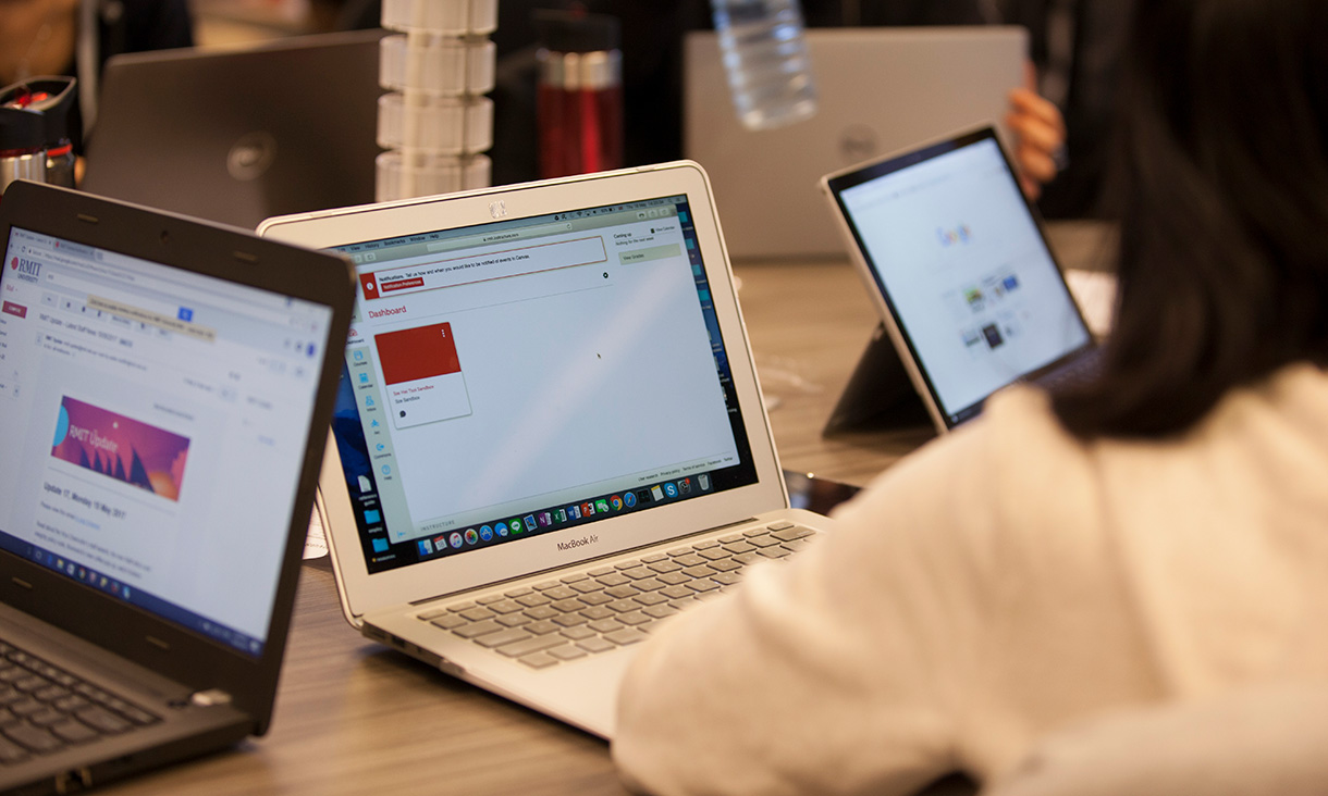 Students working on their laptops