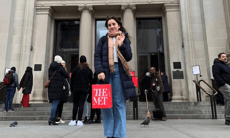 Student in front of a museum