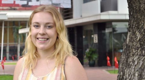 Photo of Georgia standing in front of building 