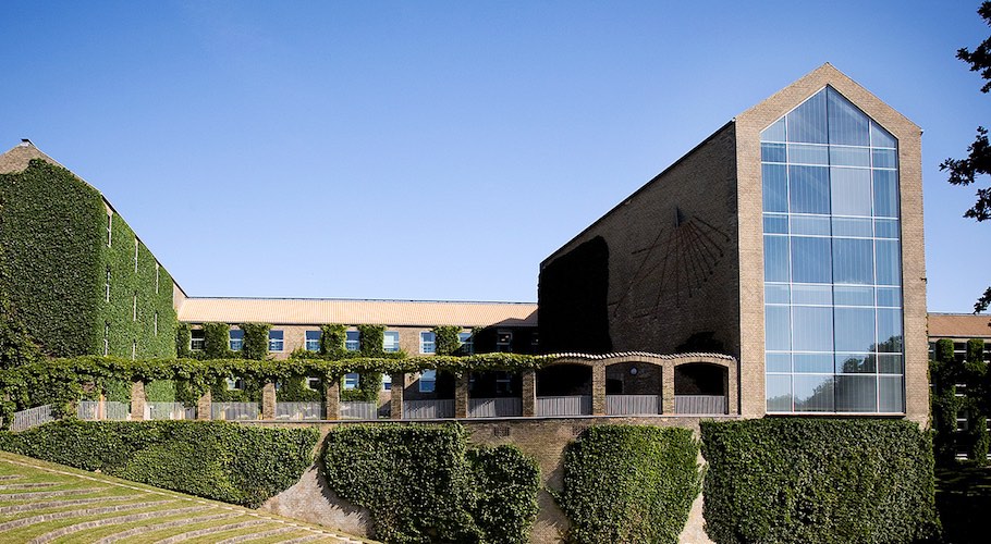 A Danish building covered in vines.