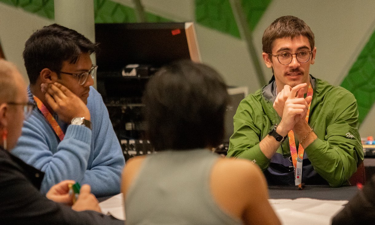 Student talking to a group.