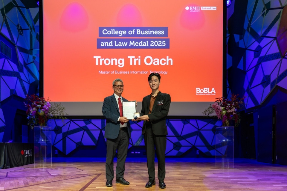 Person accepting award on stage