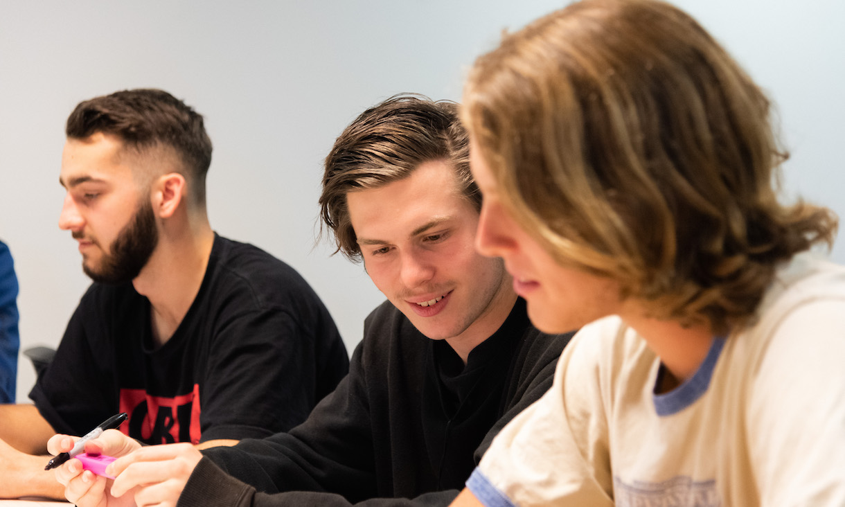 Students work on a project in a classroom.