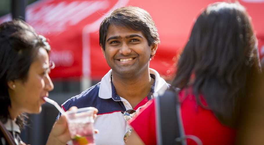 An international student smiles at the camera.