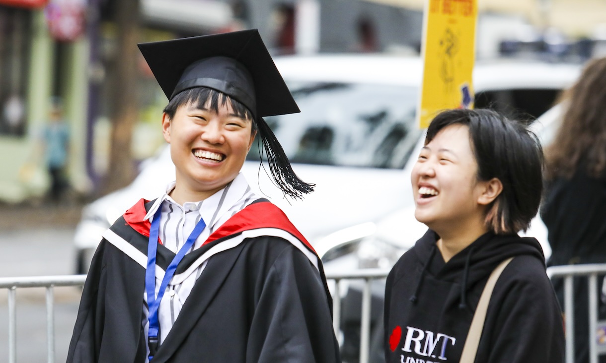 Students smiling at Melbourne Graduation Ceremony.