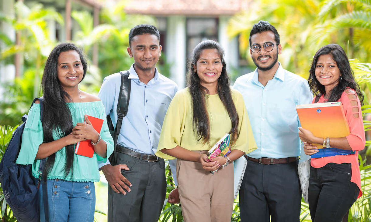 Brandix students standing and smiling at camera.