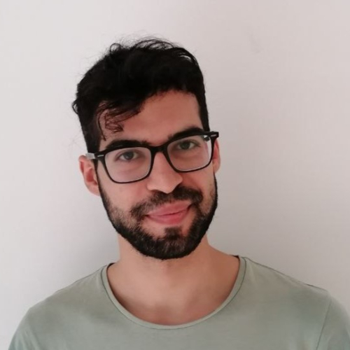 Person wearing green shirt and glasses