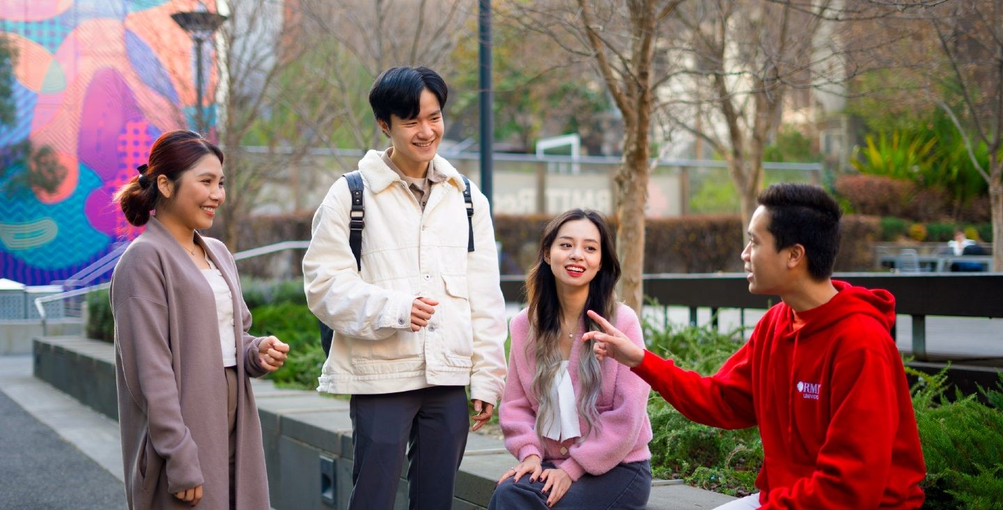 Four students talking on the RMIT City campus