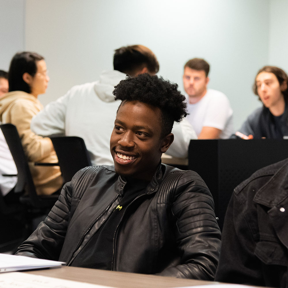 Student smiling in classroom