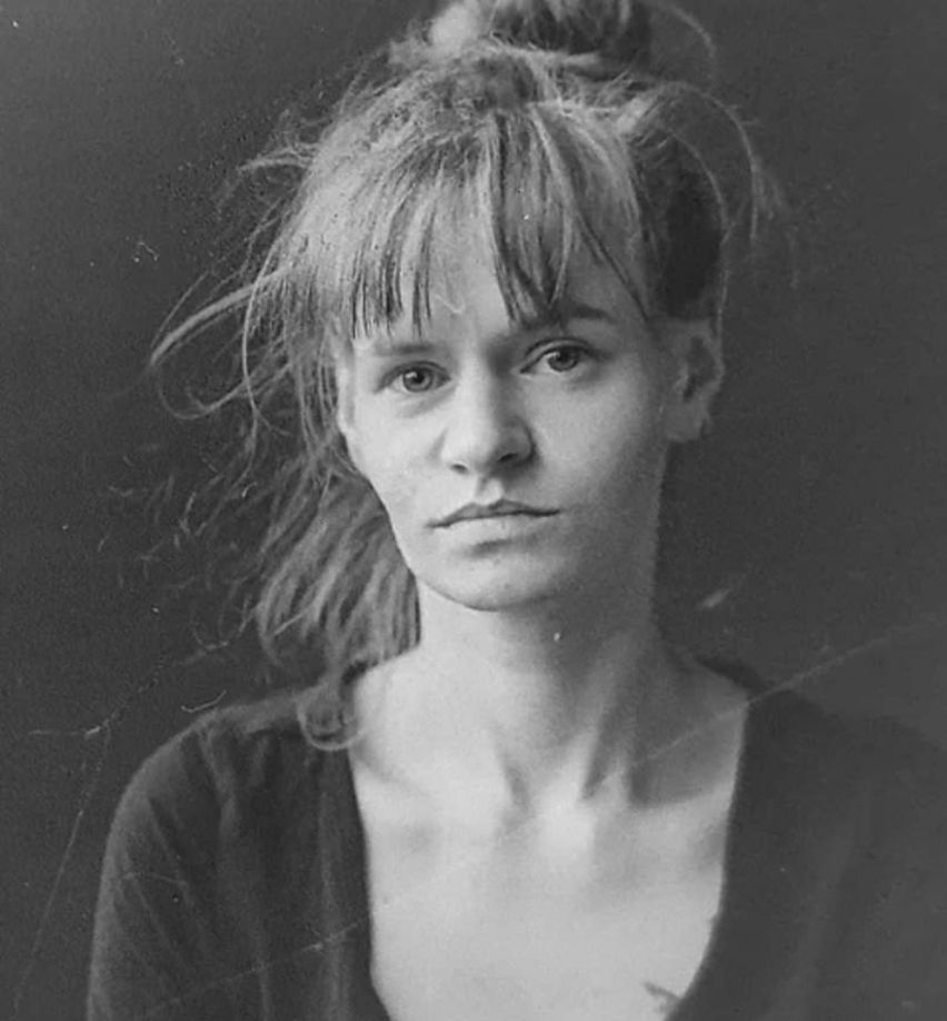 Michelle in black and white photo looking directly at camera 