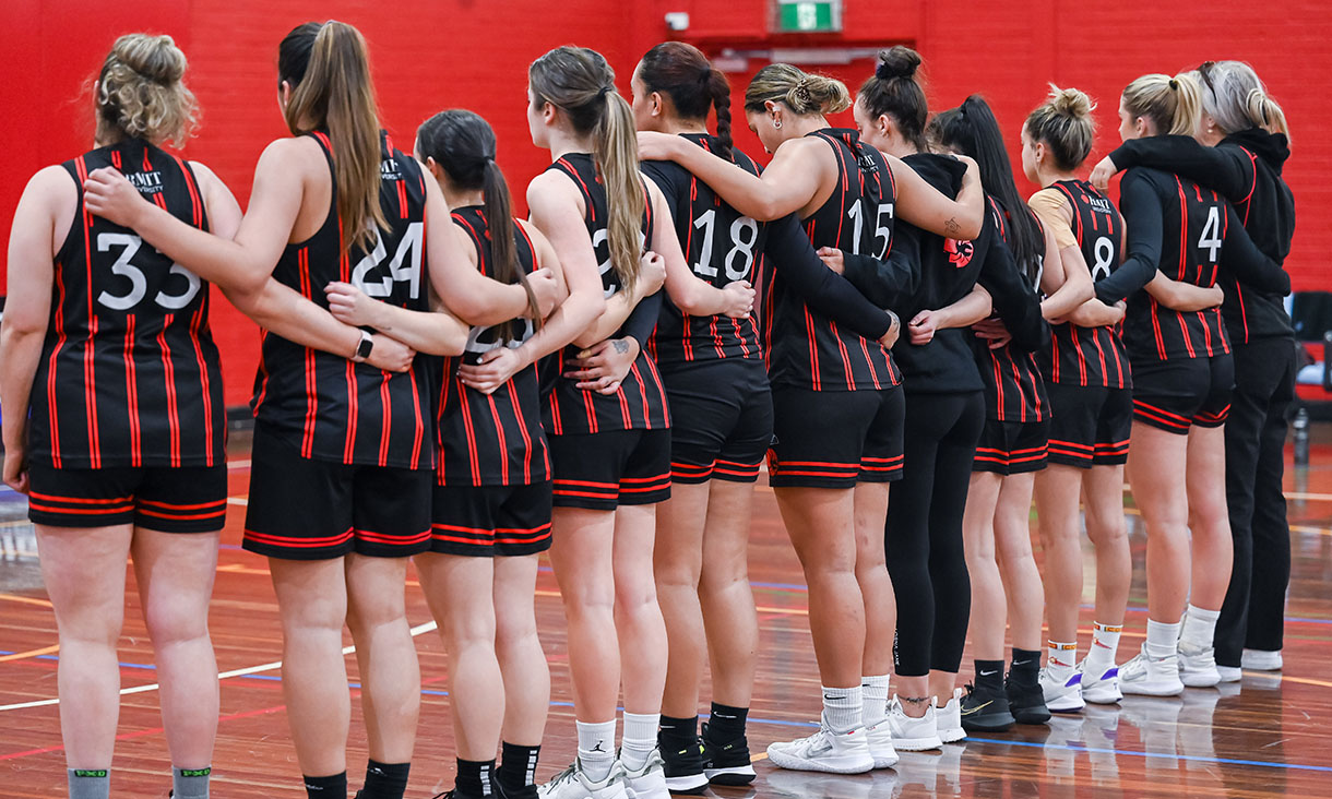 Women's basketball team line up before match