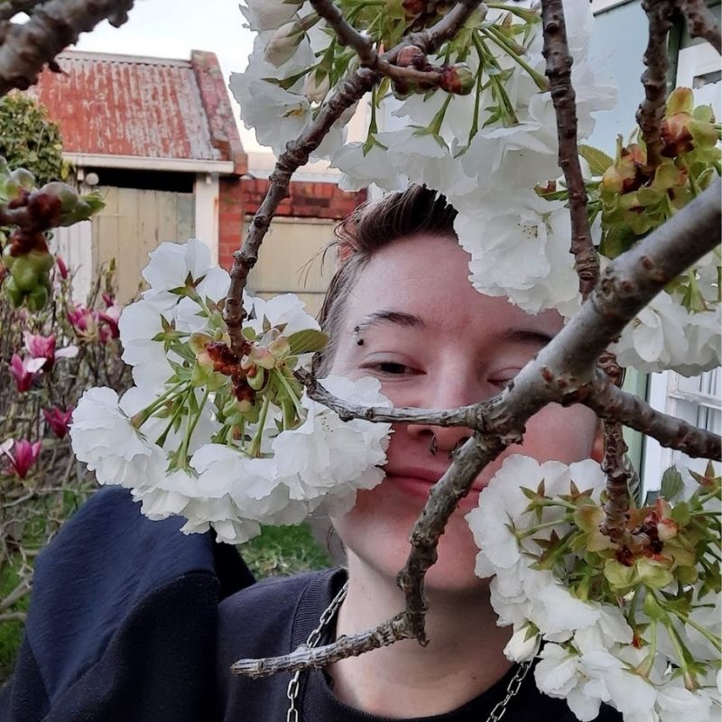 Image of Phoebe with flowers.