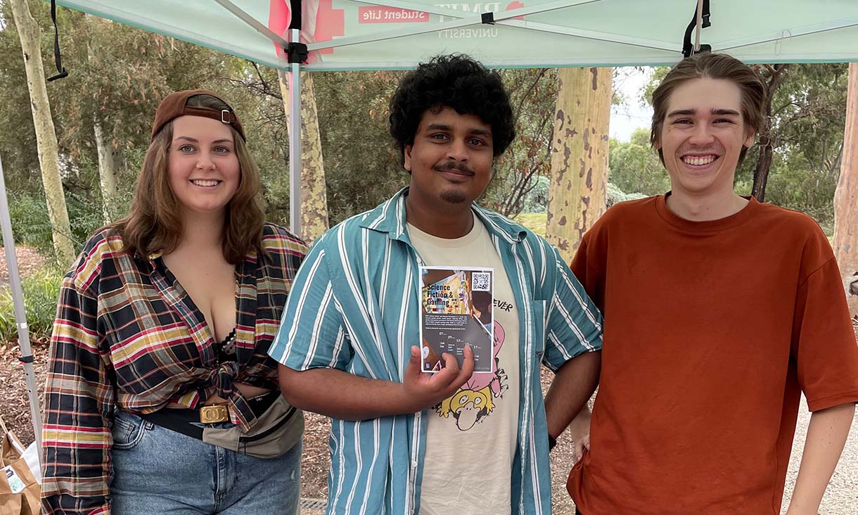 Three people smiling at camera