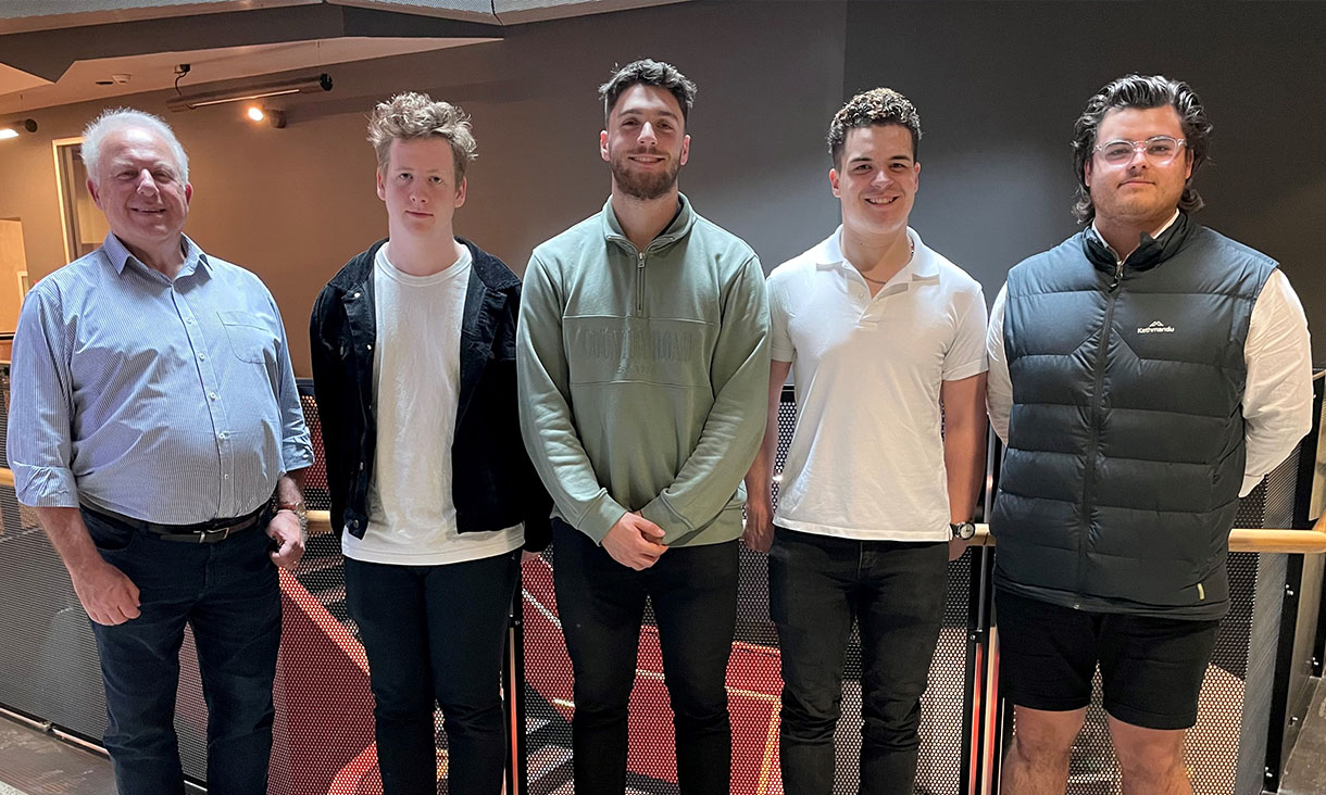 Five men together for a photo