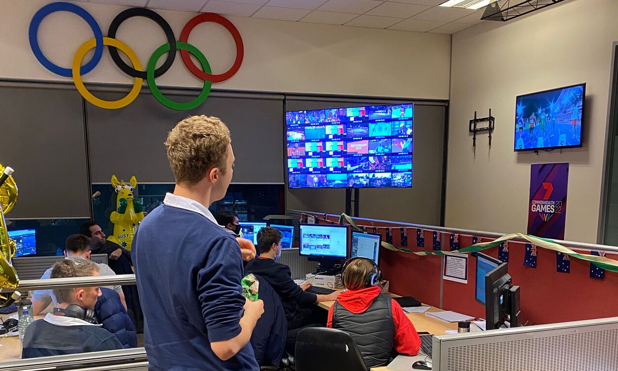 group of people working inside broadcast room