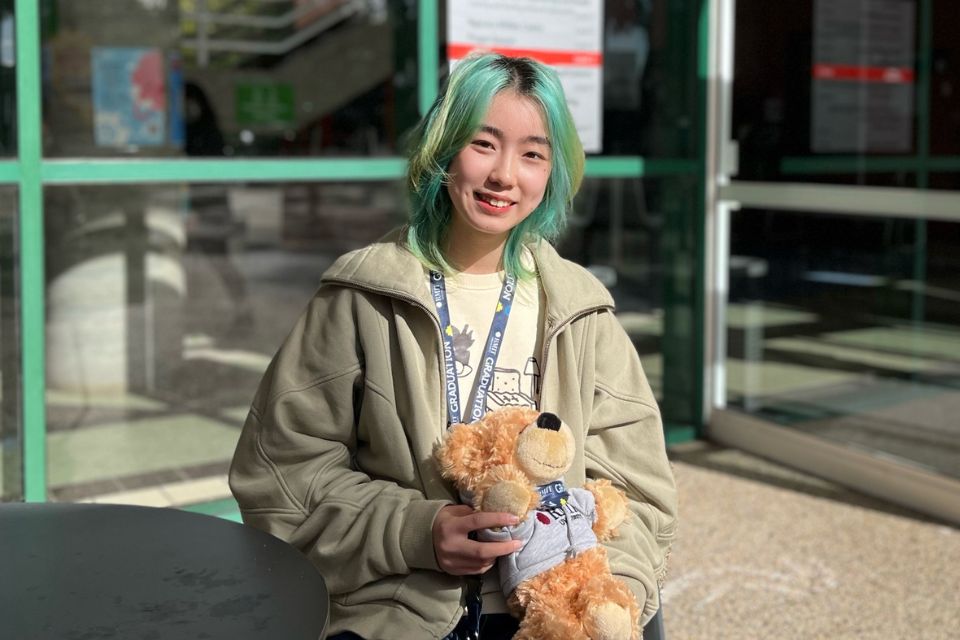 Mo Wang smiling toward camera 