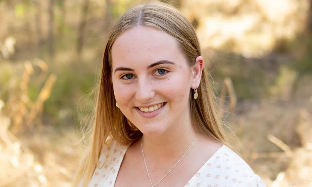 Five people smiling for a photo