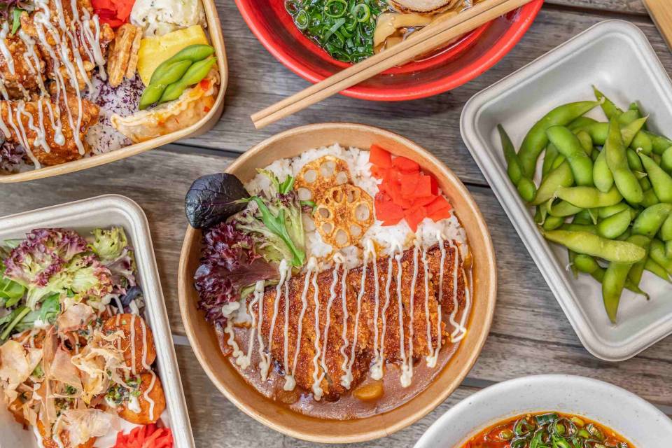 Various warm Japanese meals including Karaage chicken curry and edamame