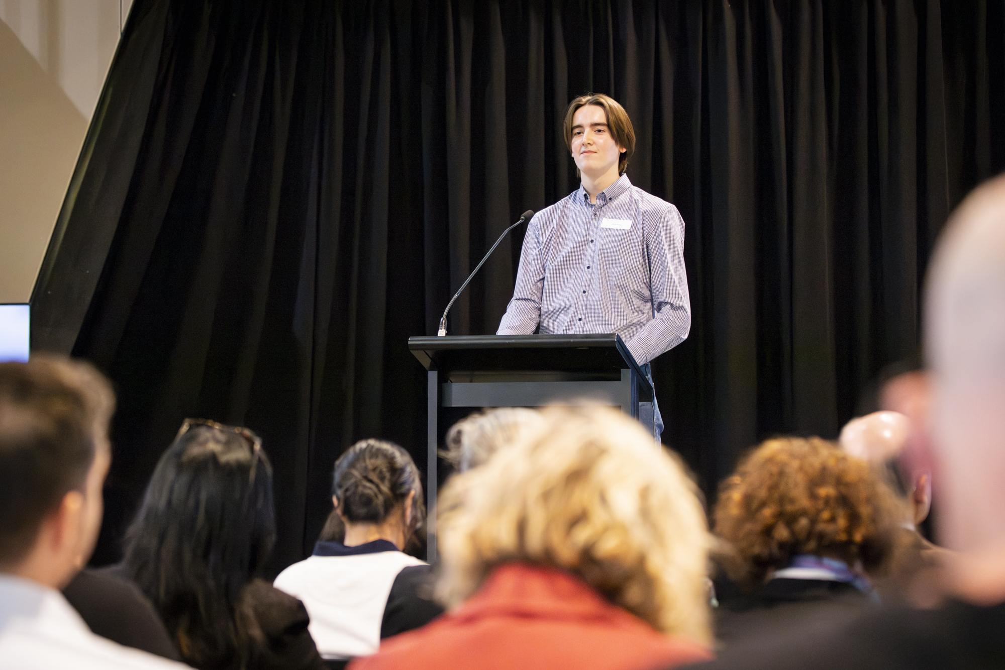 Oscar James presents his oral during the 2025 Science WIL Showcase.