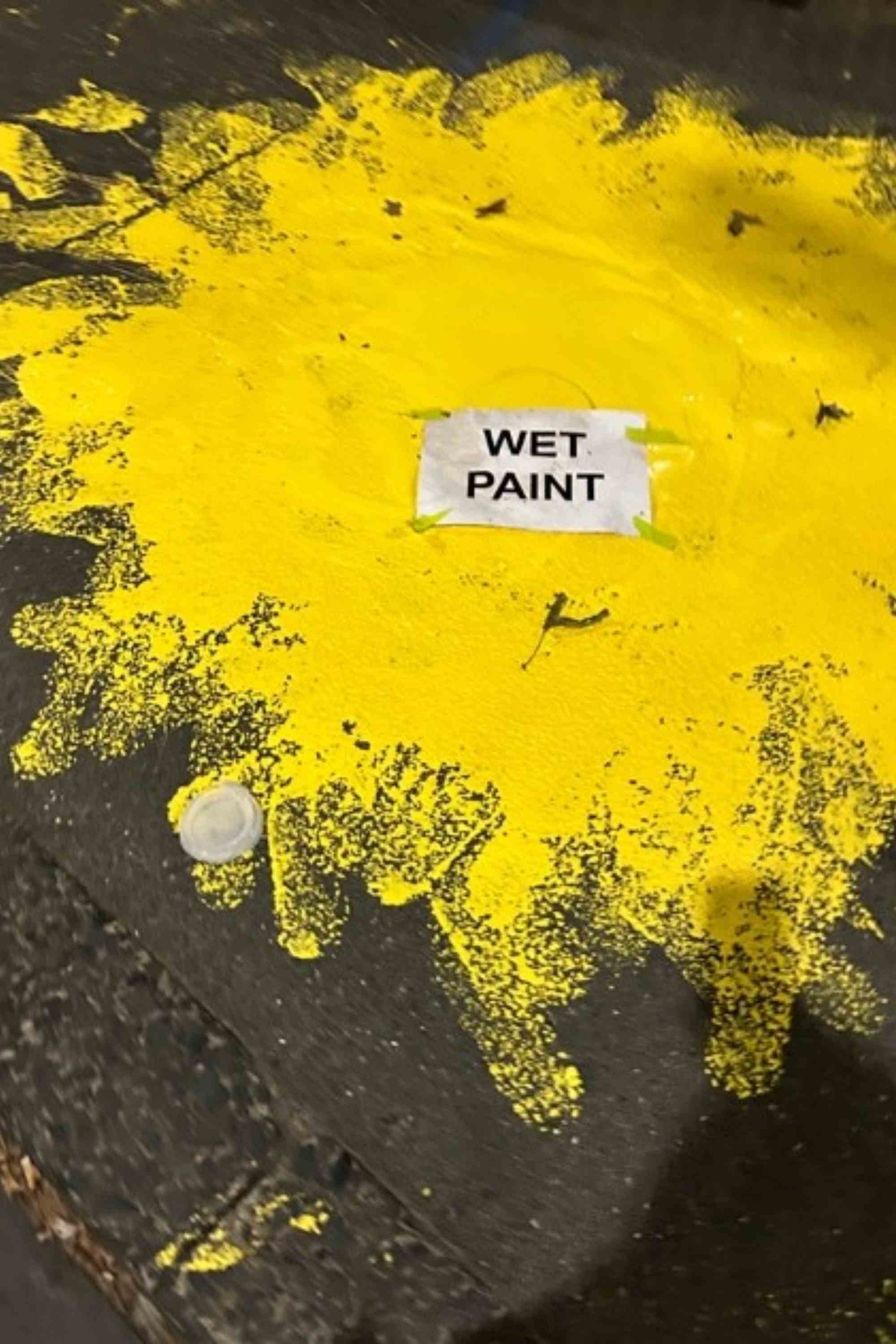 Yellow paint puddle Sophie Stavrakis noted outside RMIT's Design Hub that sparked inspriation for her Connect the Dots artwork. 