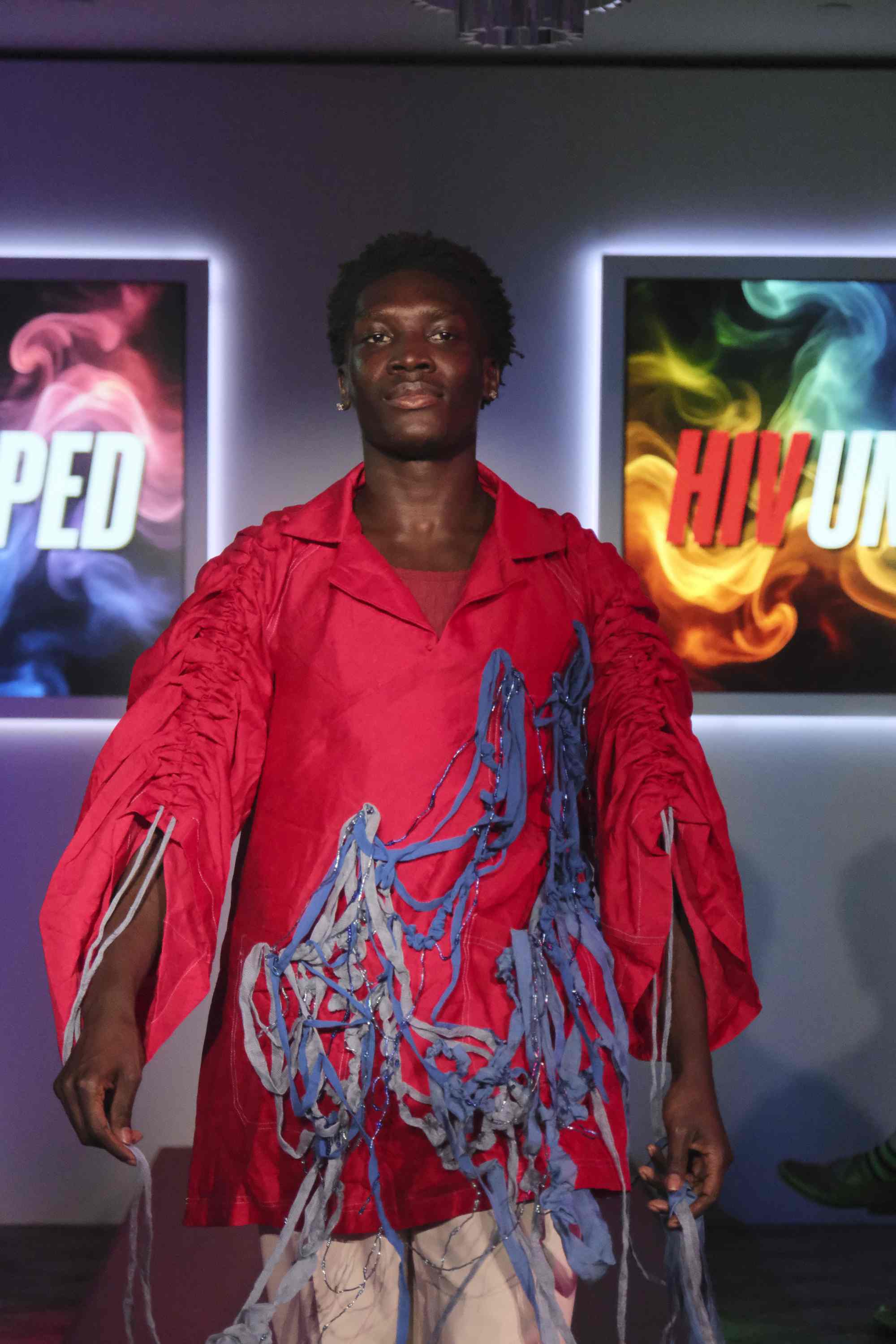 Model wearing Flora Bellemo'sFlora Bellemo’s lab coat-inspired creation, developed through a collaboration with HIV researchers at New York City Fashion Week.