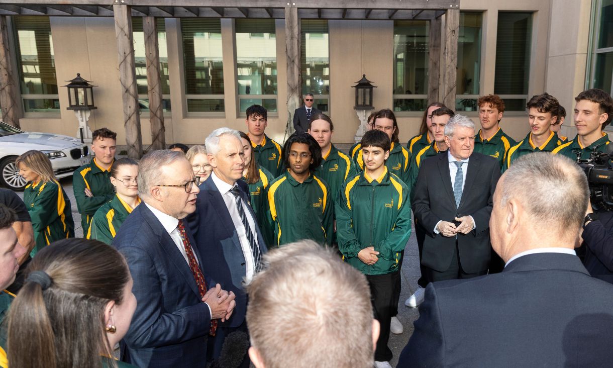 Group of people standing outside talking