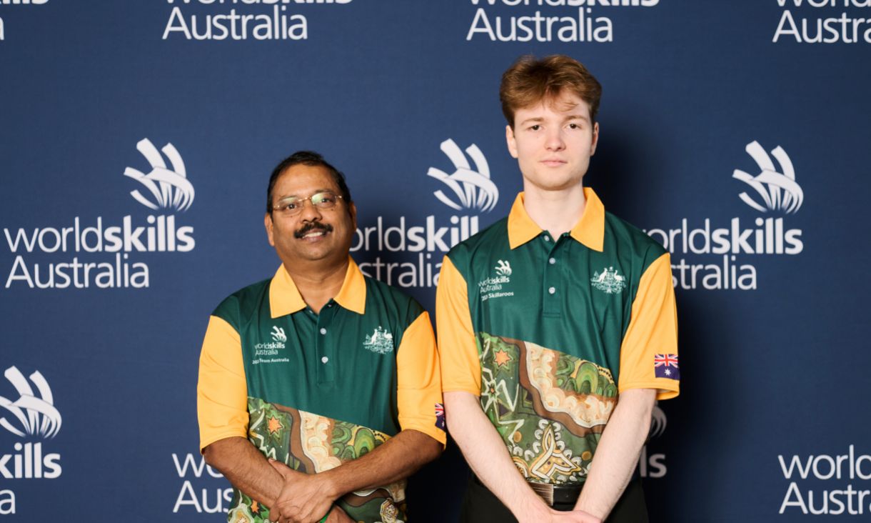 Two people smiling at camera