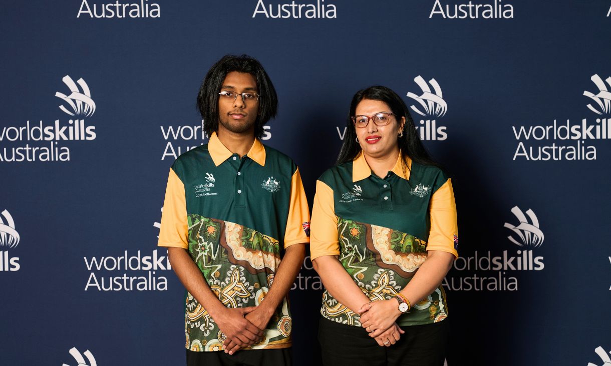 Two people smiling at camera