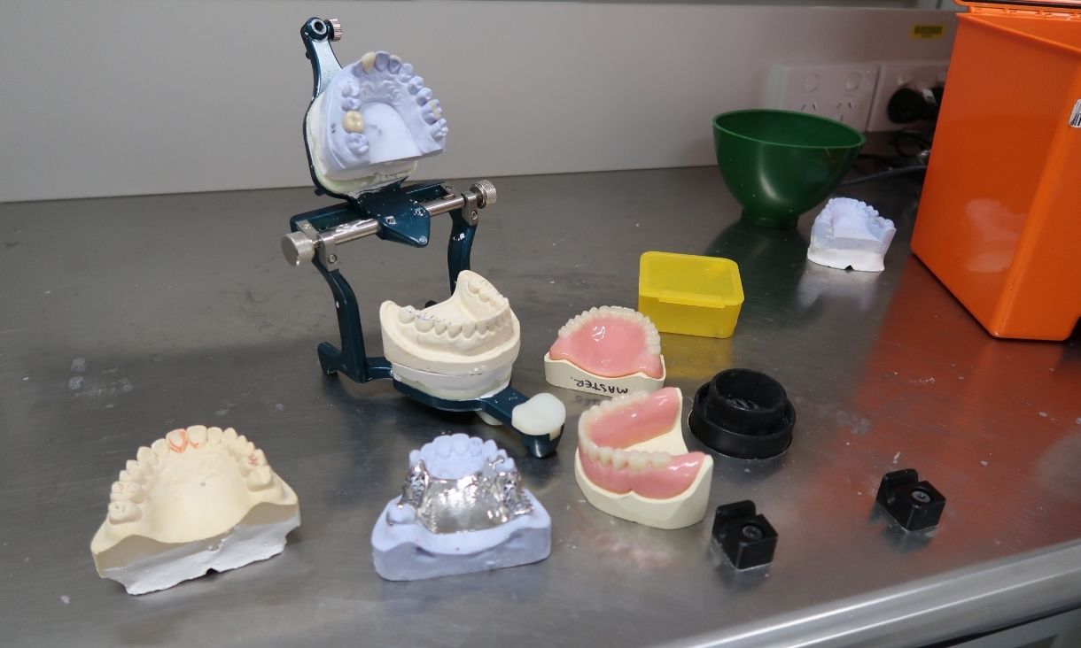 Dental prosthetics on metal bench