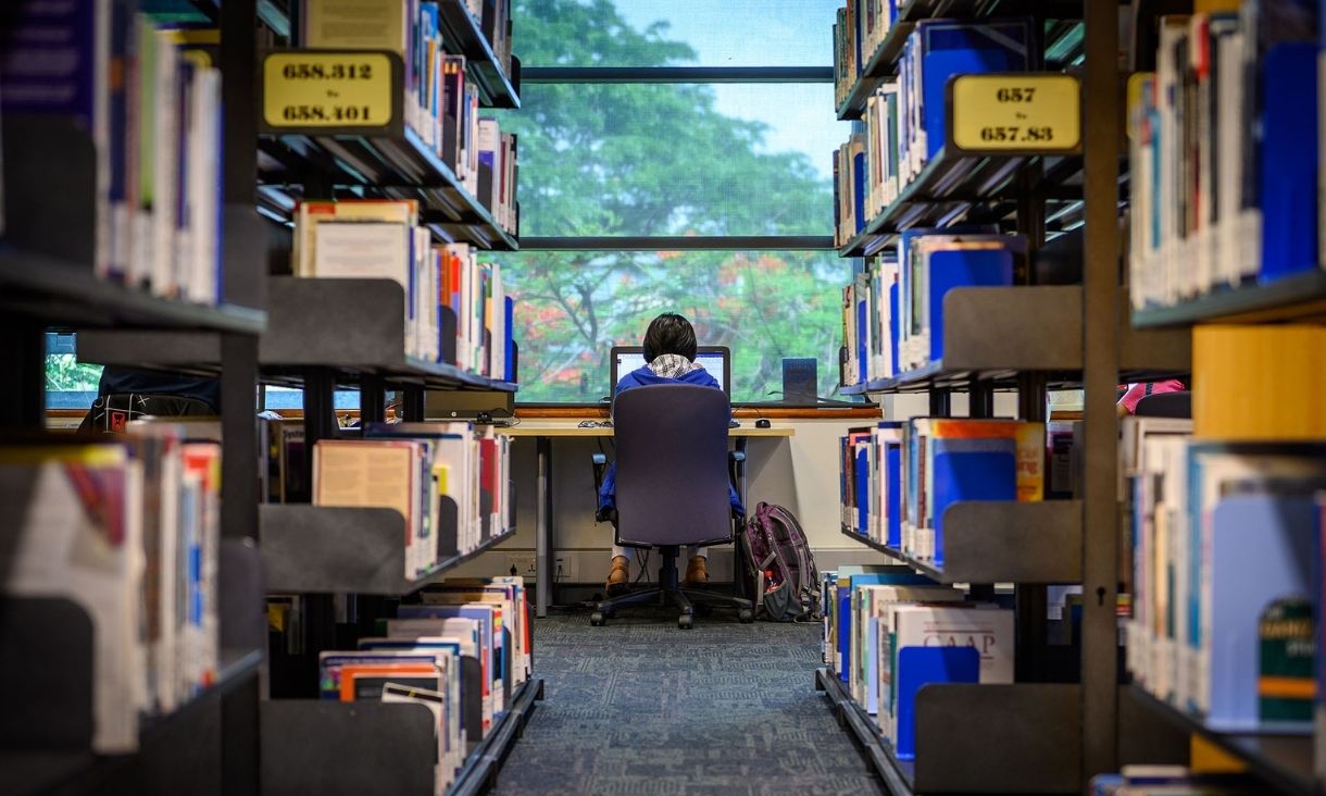 Student in library studying