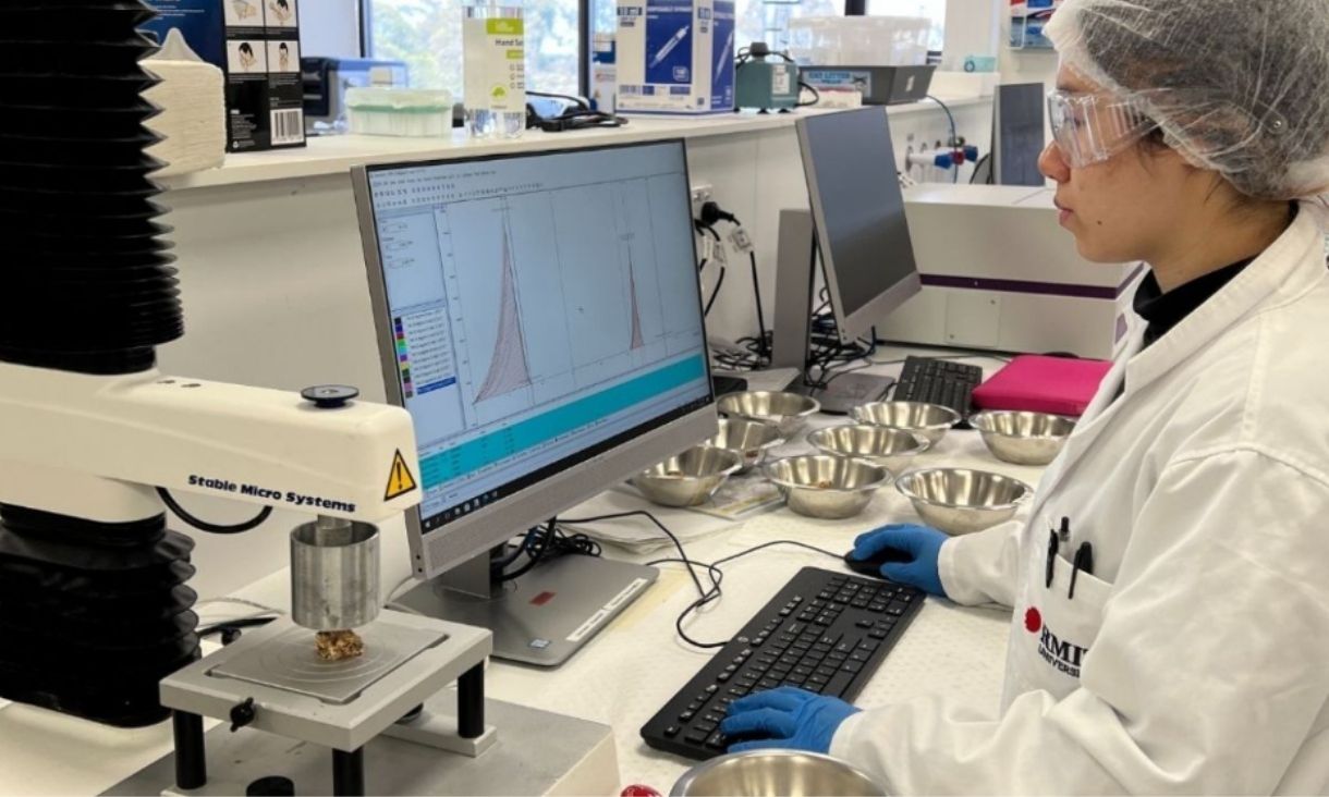 Person sitting in lab at computer
