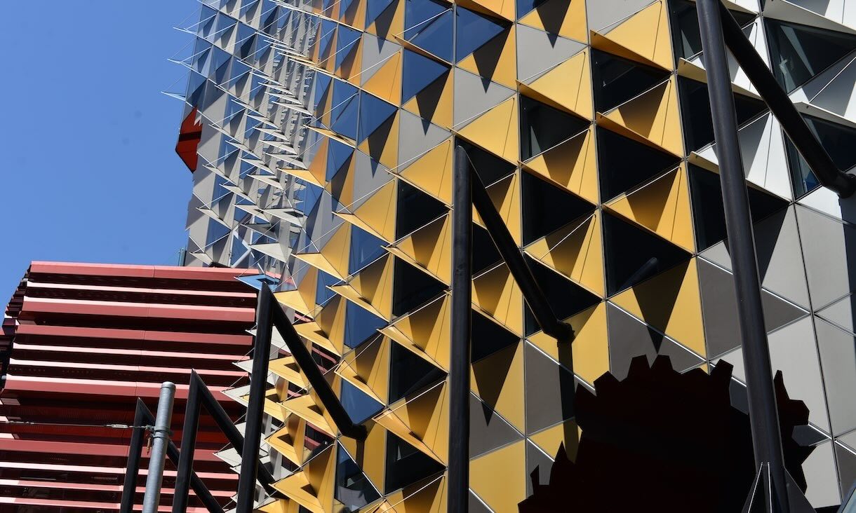 Building 80 exterior with yellow triangles.