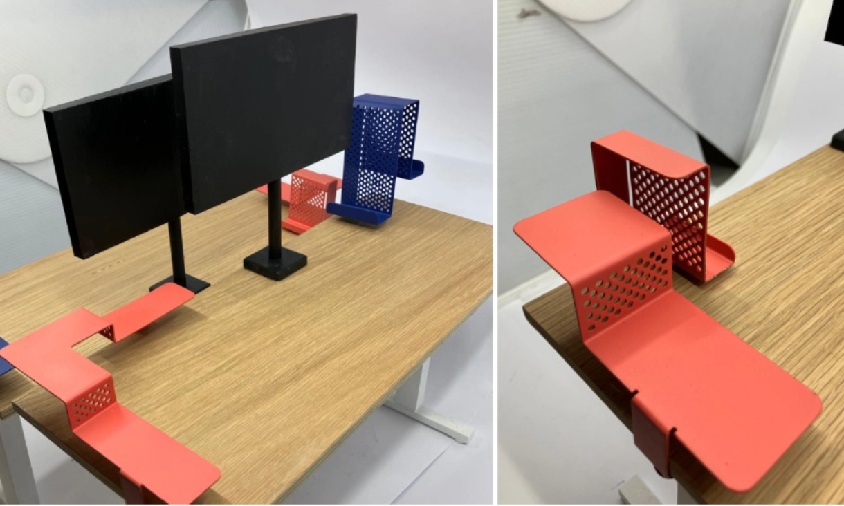 orange and blue metal sculptures on desk