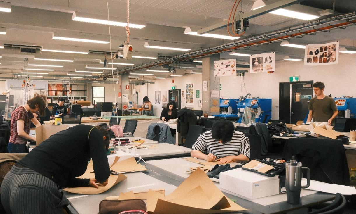 Students in a shoemaking workshop