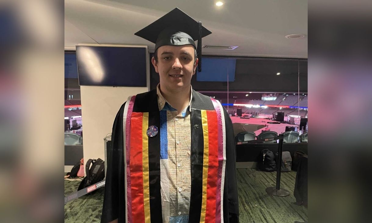 Tobi attending graduation for his VE studies.
