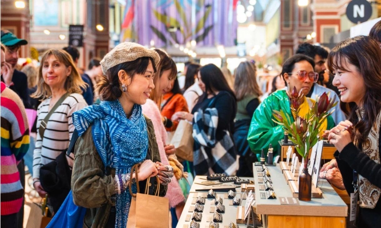 People shopping at design market