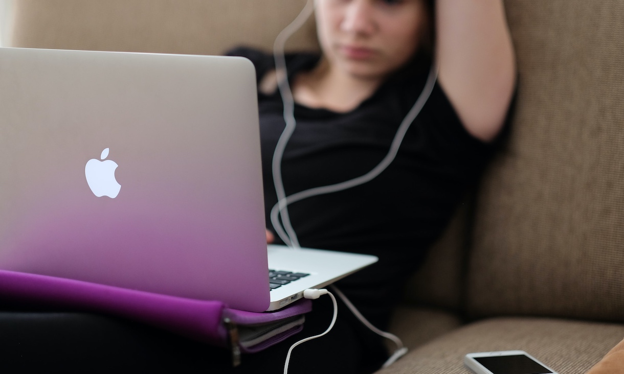 Girl looking stressed at computer.