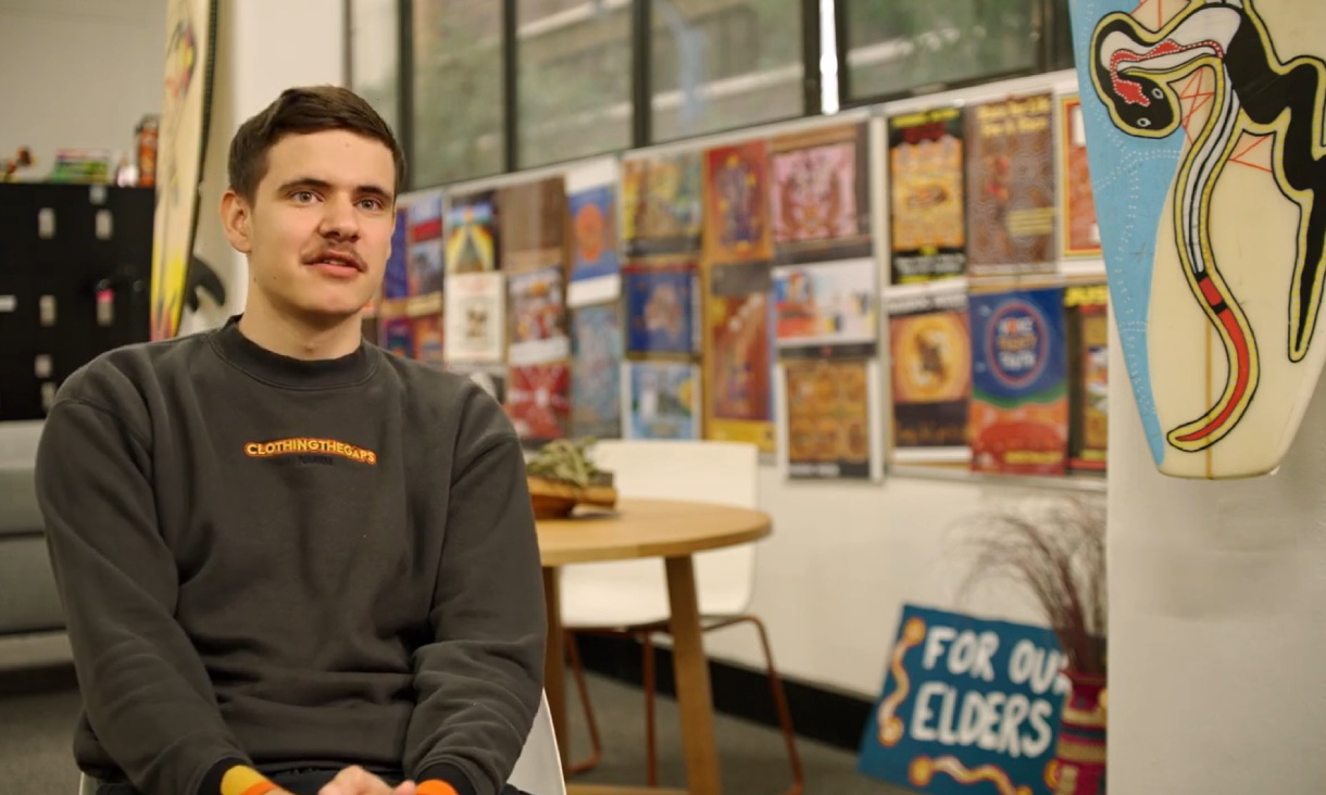 Two people sitting outside