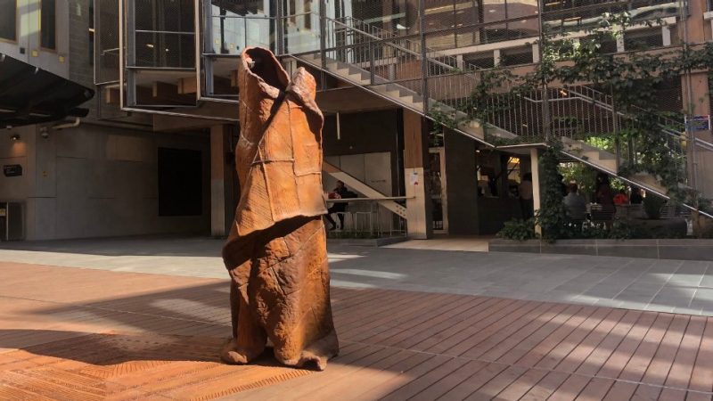 A possum skin statue stands at the City Campus.