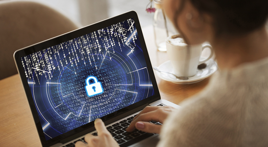 A student works on a laptop.