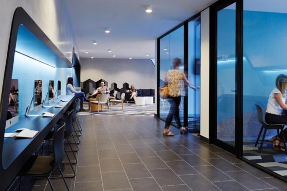 Interior of Scape Swanston that features a staircase and communal area.