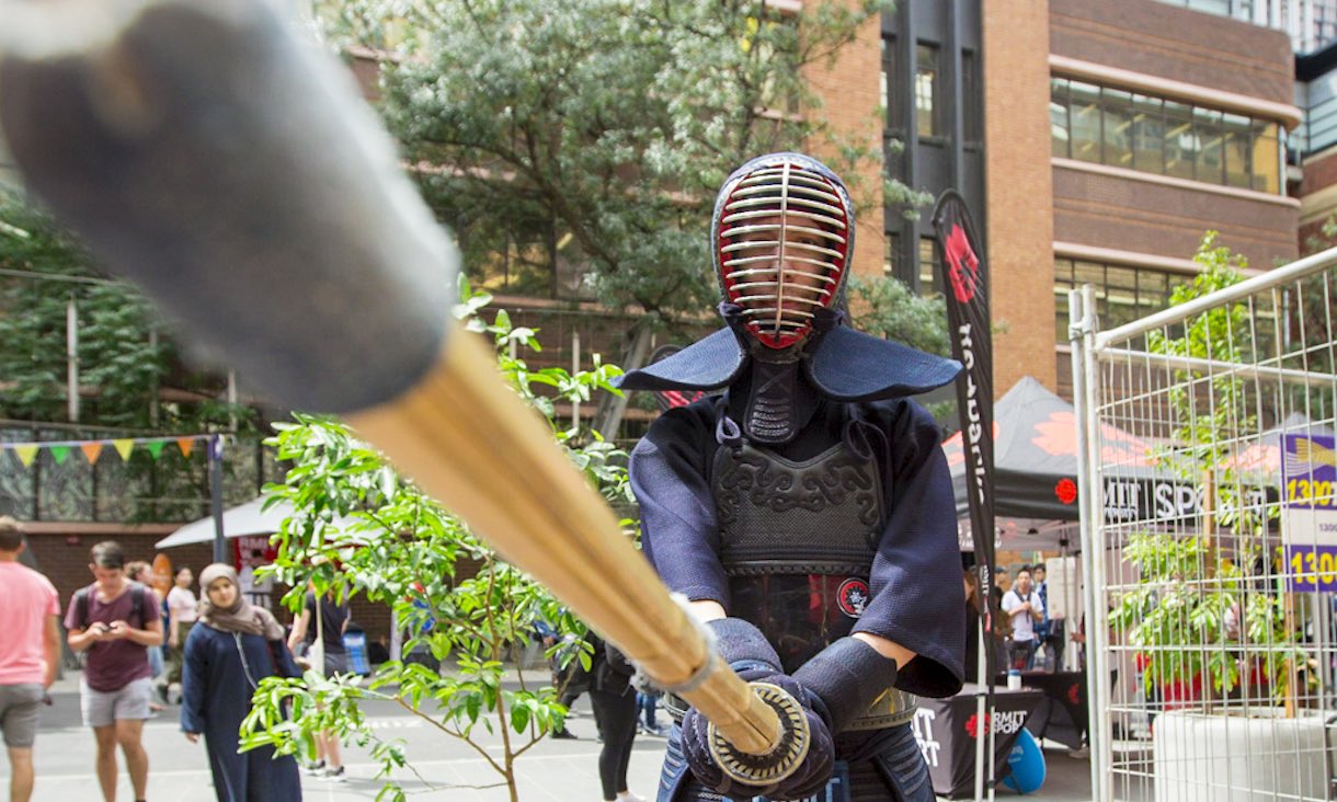 Kendōka holding bamboo sword.
