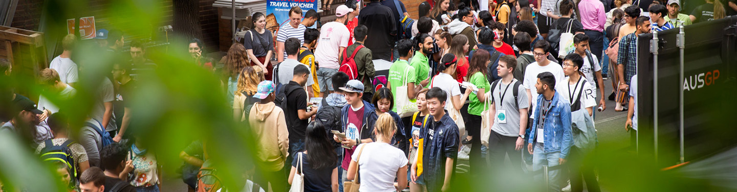 Overhead shot of a club event through some leaves