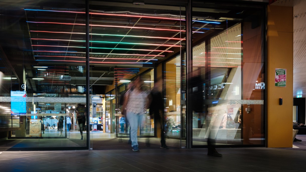 Image of people walking through sliding doors
