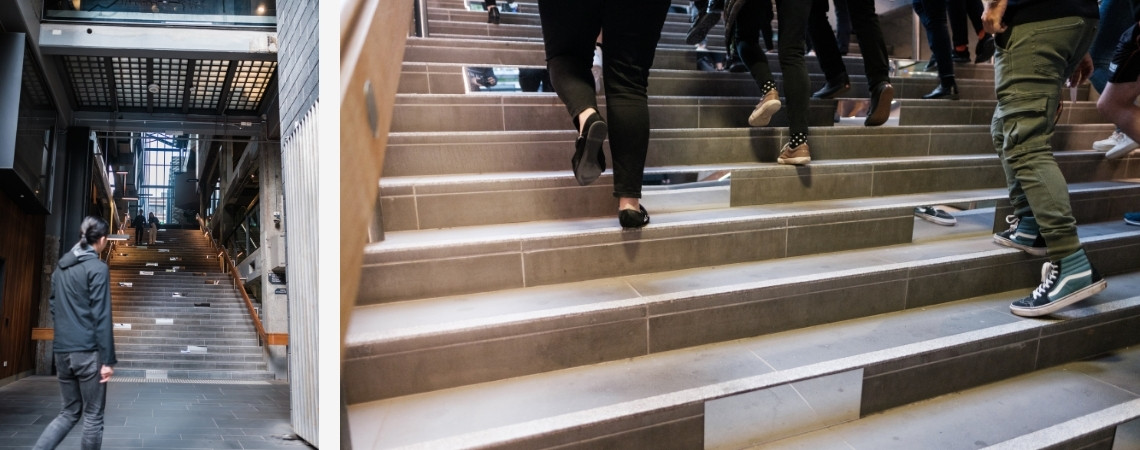 People walking up concrete stairs