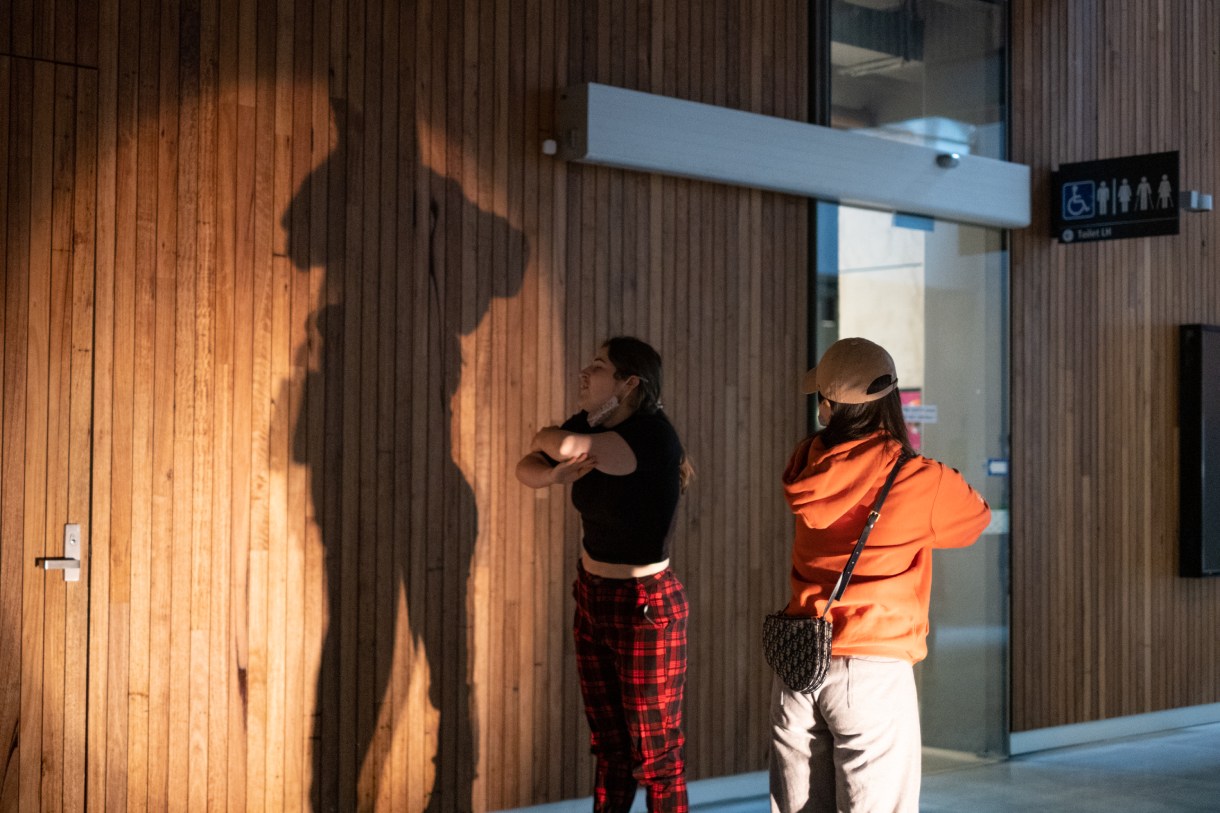Two people making shadows