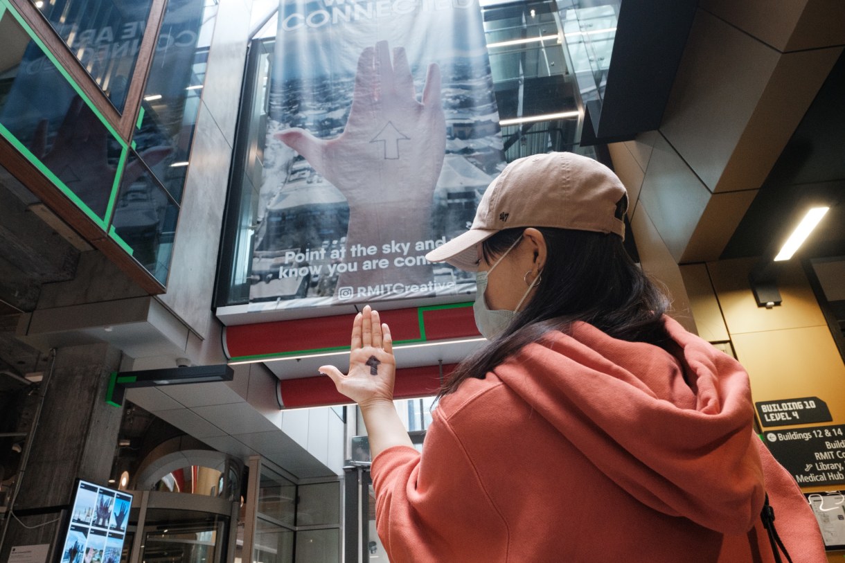 Person with arrow drawn on hand
