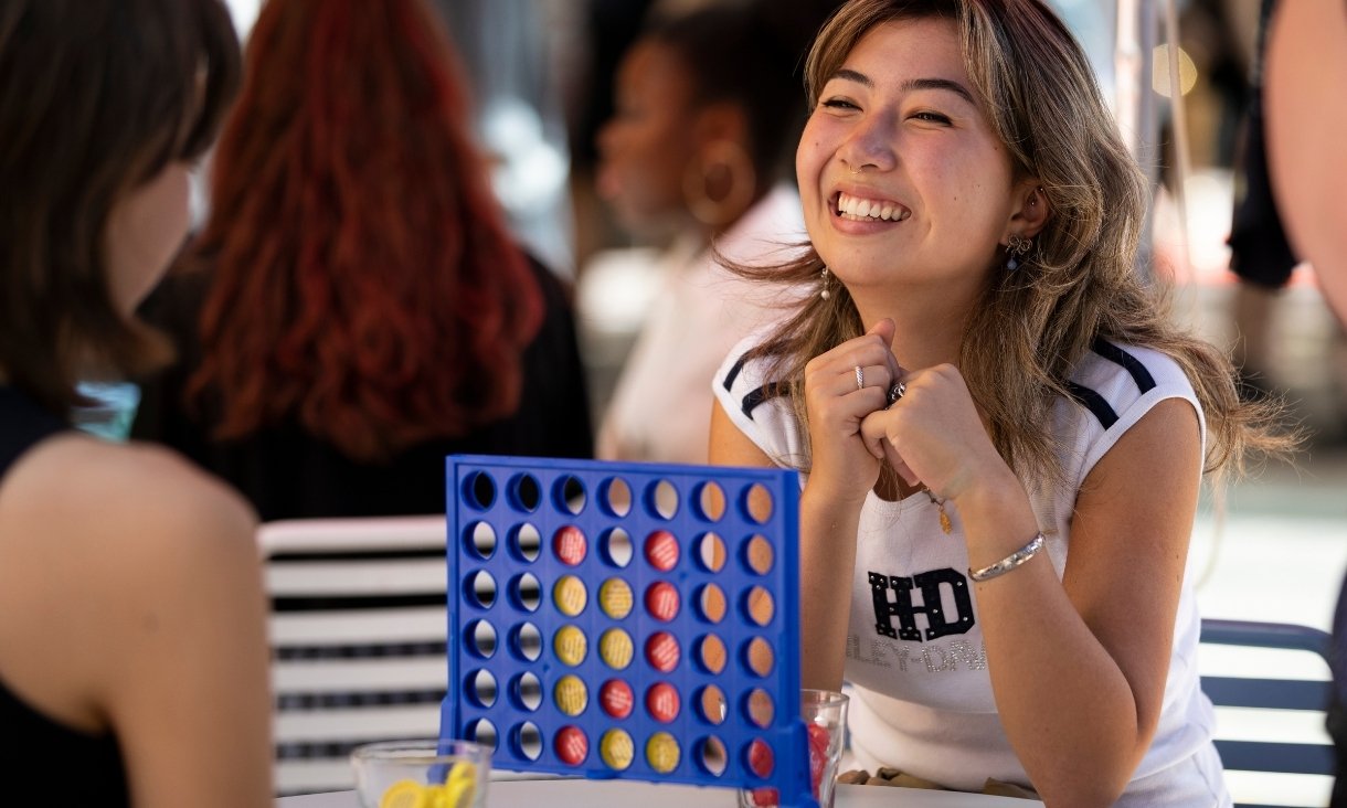 People playing connect 4 