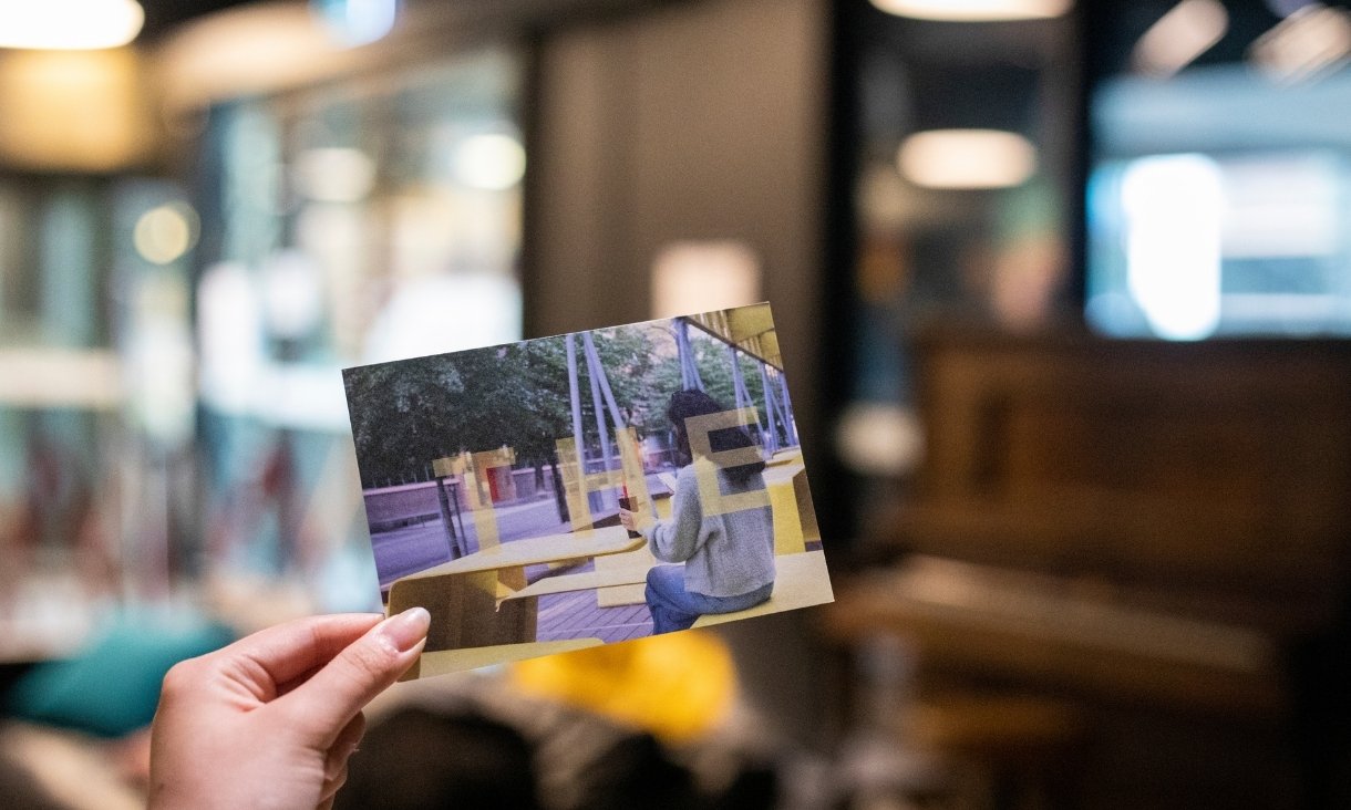 Person holding photograph
